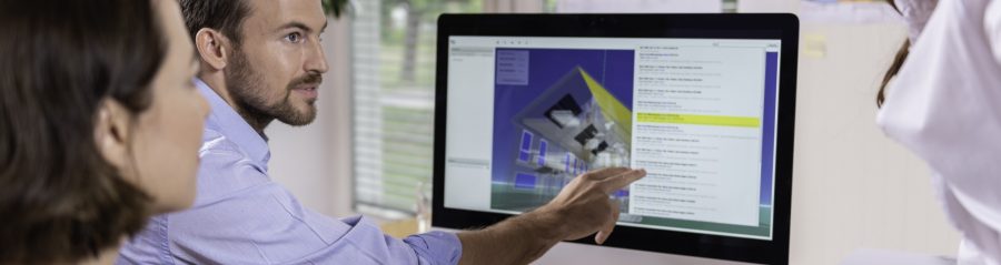 Project managers at office desk working with BIM